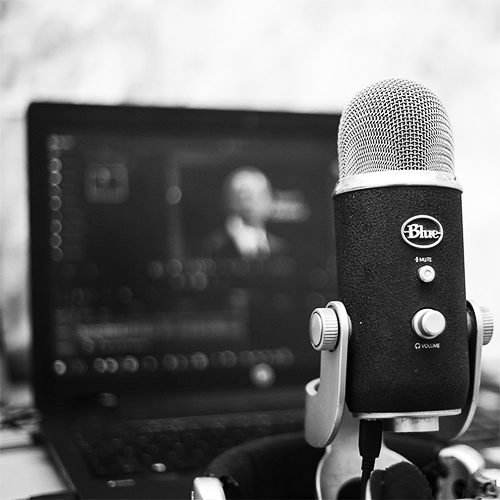 Close-up of microphone and computer